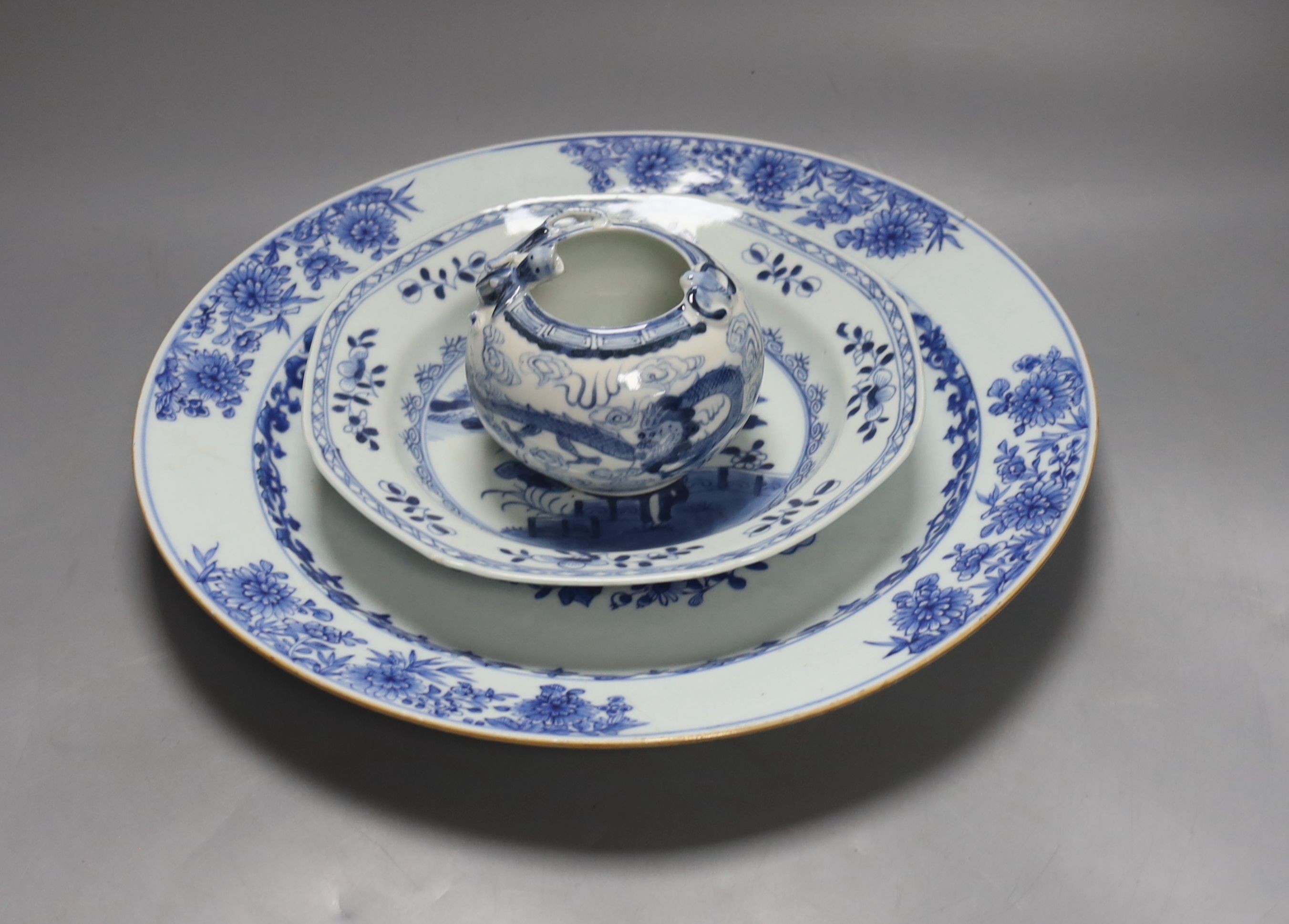 Two 18th century Chinese blue and white dishes and a water pot, largest item 34.5 cms diameter.